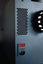 Close-up of PureFluxion P1 rear ventilation grille, power switch and power inlet
