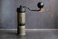 SOU SIK stainless steel manual coffee grinder with LeBrew Burrs 01 system, showing the hand coffee grinder design and burr structure details.
