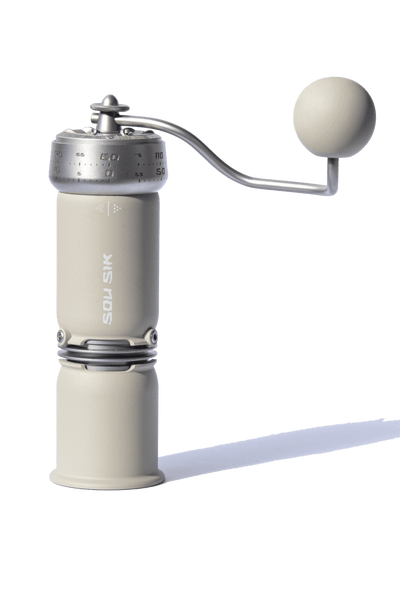 SOU SIK stainless steel manual coffee grinder with LeBrew Burrs 01 system, showing the hand coffee grinder design and burr structure details.
