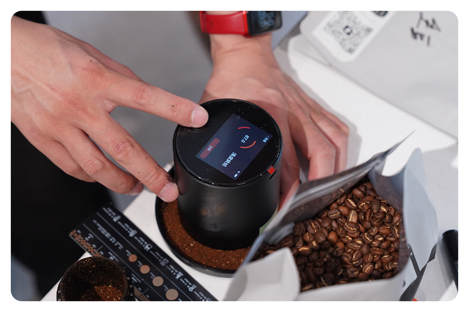 A LeBrew measurement instrument being used with coffee samples
